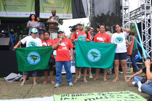 foto - assembly participation MNCR and Red Lacre leaders stating demands at the summit-wide assembly.