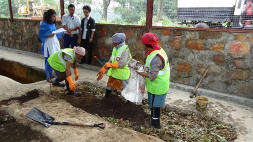 SHG members engaged in the process of composting